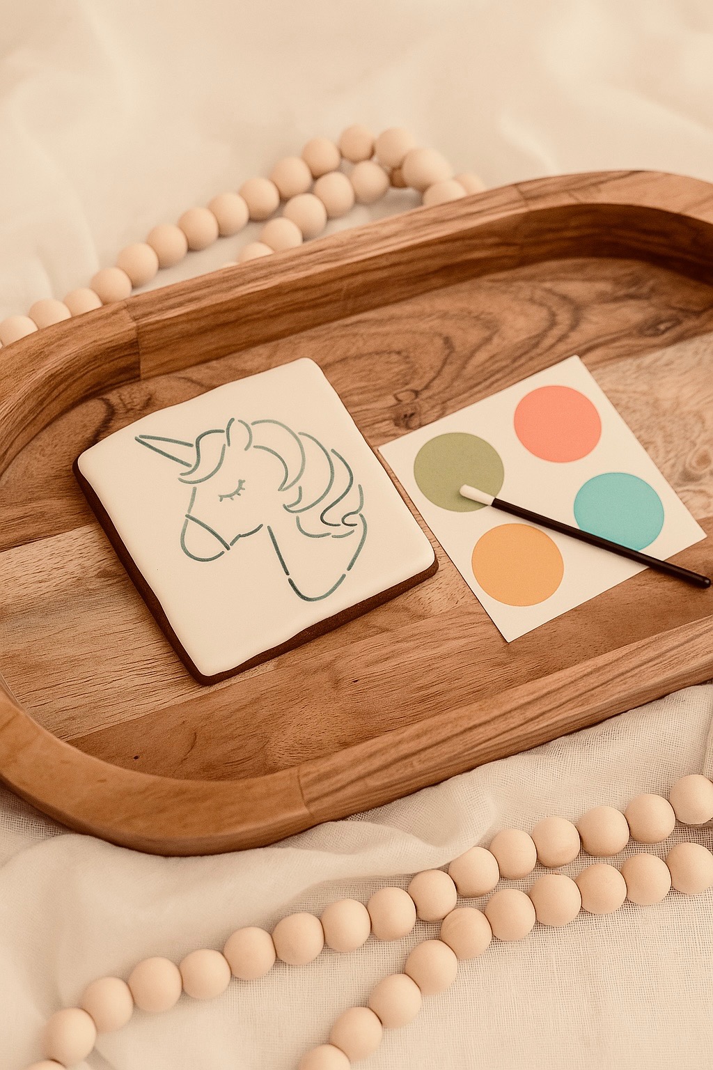 PYO Paint Your Own unicorn cookie with colorful edible paint palette and brush for kid-friendly decorating